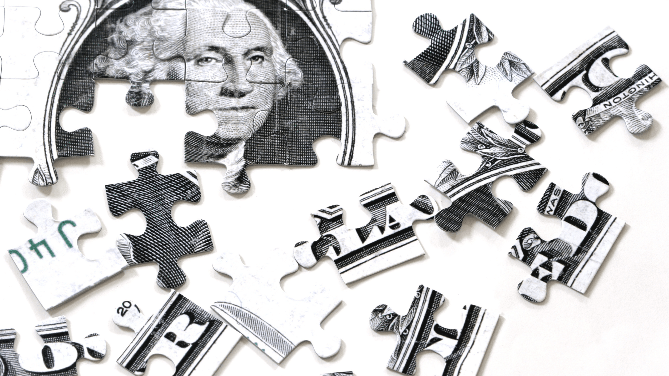 Dollar bill as puzzle pieces being put together